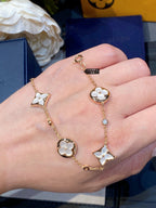 ??MIRA?¡¥STAR AND SUN 4 MOTIF WHITE MOP PINK GOLD BRACELET